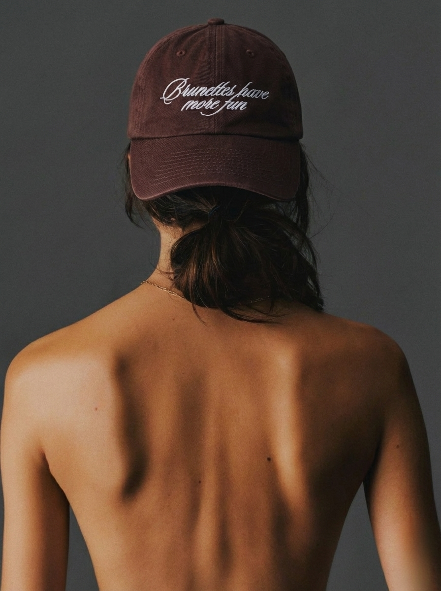 Back view of brown embroidered baseball cap for women reading “Brunettes Have More Fun”